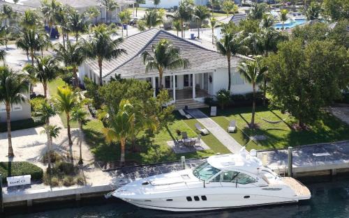 Alice Town Villa | Waterfront Home w Ocean View Pool, Dock and Games