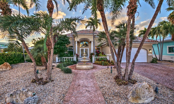Coury House | Serene Waterfront Oasis with Boat Dock & Heated Pool