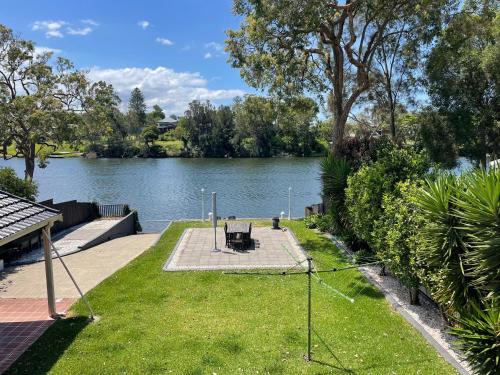 Dora Creek House | Waterfront Entertainer Home with Hot Tub & Family Fun