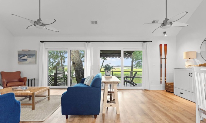 Pine Harbor House | Waterfront views of the beautiful Sapelo river from the living room and porch!