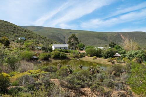 Van Wyksdorp House | Cozy Watermill Farm Cottages with Refreshing Pool Access