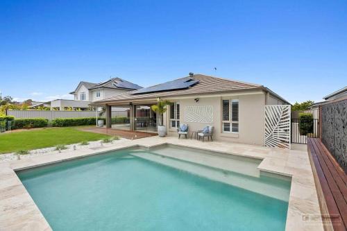 Banksia Beach House | Waters Edge: Family-Friendly Stay with Pool Access