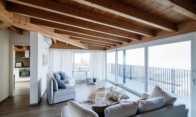 Lipomo Apartment | Elegant White Attic – Family-Friendly Stay in Como