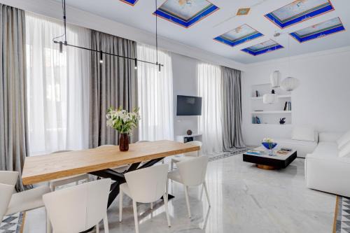 Ermoupoli Apartment | Stylish White Loft Syros with Hot Tub & 9.4/10 Rating