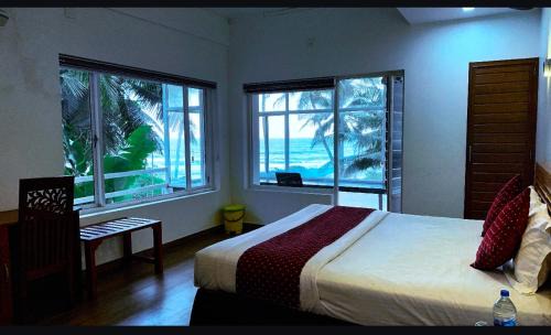 Kannur Resort | Oceanfront White Shell Beach House with Breakfast Included
