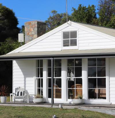 Falmouth House | Beachfront White Shell Cottage with Ocean Views & Firewood