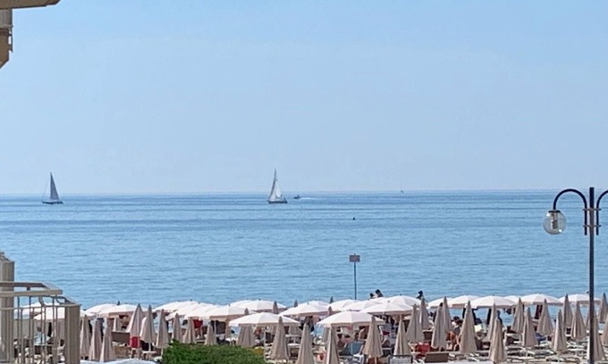 Lido di Jesolo Apartment | Cozy White Suite by the Sea with Ocean Views and Spa