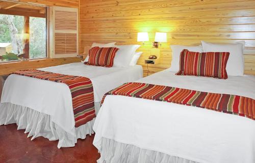 Wimberley House | Inviting Wimberley Log Cabins Resort with Pool & Family Fun