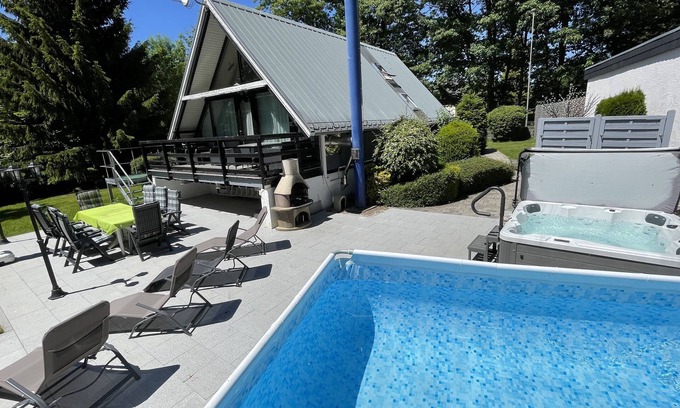 Waldsiedlung Romerstraße House | Cozy Retreat with Sauna, Fireplace & Ocean View Amenities