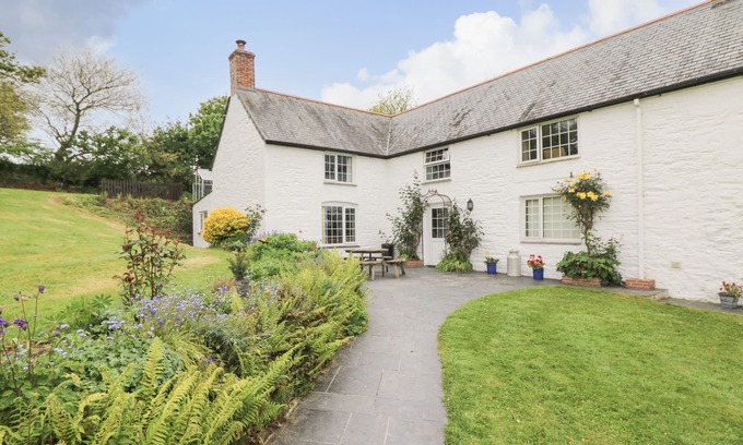 Helford Passage Cottage | Family-Friendly Withan Farm Wing: Cozy Fire & Kitchen Amenities
