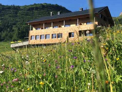 Warth Apartment | Wolfegg Appartement: 4-Star Haven with Café & Spa