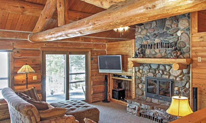 Oslund House | Beautiful Sand Lake Retreat with Expansive Porch & Spa