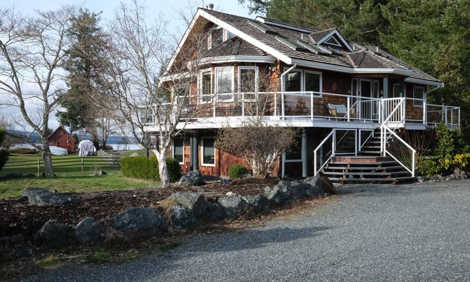 Fanny Bay House | Ocean and Mountain Views from a Wraparound Deck Retreat