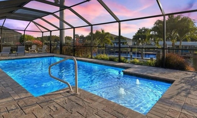 Yacht Club House | Yacht club area of Cape Coral w/Saltwater Pool, Dock & Theater Room