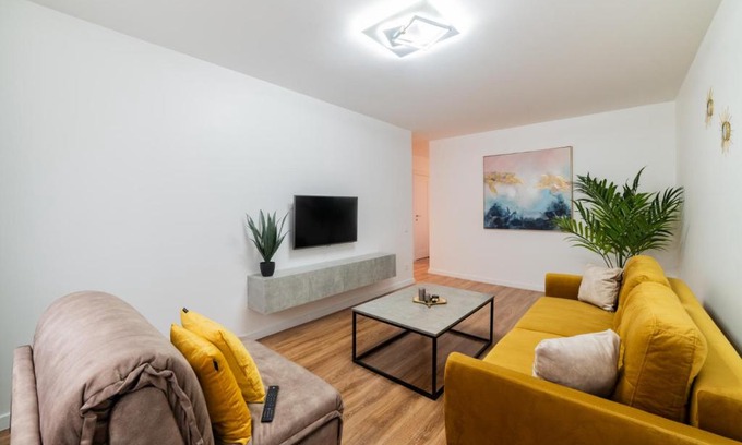 Siauliai Apartment | Inviting Yellow Apartment - Child Friendly & Rated 9.5/10