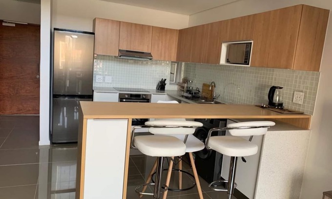Windhoek Central Apartment | Your Ideal Retreat in Namibia: Pet-Friendly & Pool Access
