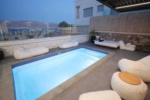 Eilat Villa | Relax at Z Lotus Garden: Poolside Oceanfront Retreat