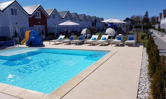 Mielno Resort | Discover Zatoka Slonca: Poolside Retreat with Ocean Views