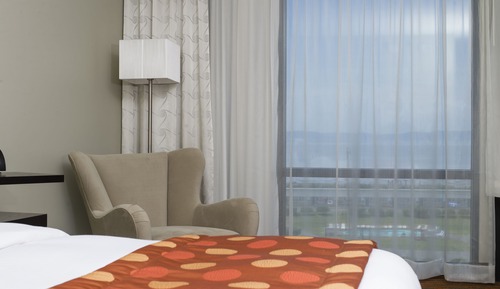 Aqua room with 1 king bed, river view