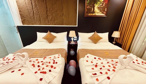 Deluxe Quadruple Room, 2 Queen Beds, Balcony, City View