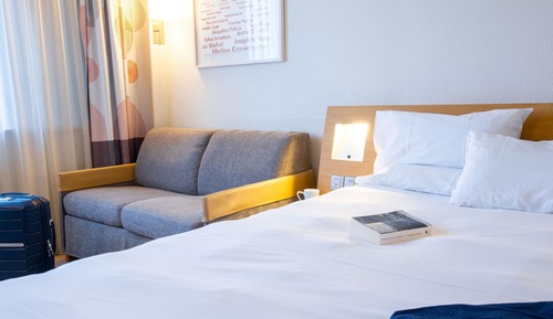 Standard room with 2 single beds and 1 sofa