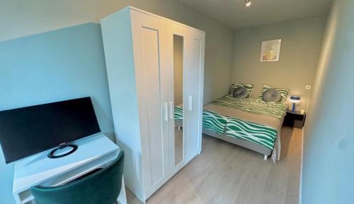 Four-Bedroom Apartment with Balcony 