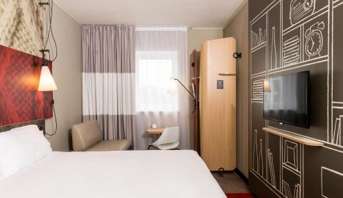 Room with one Queen bed and sofa