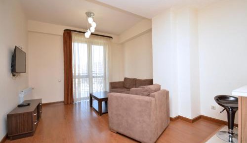 One-Bedroom Apartment with Balcony and City View