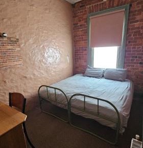 Queen Bed with Shared Amenity