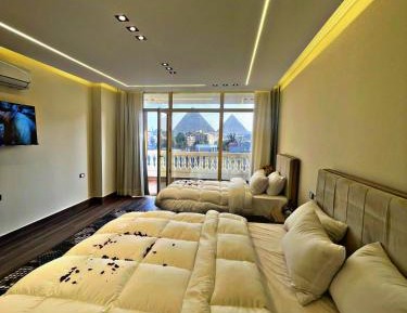 Triple Room with balcony pyramids view