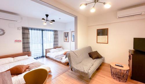 Deluxe Room with Kitchen (2 Double Beds and 1 Sofa Bed) - Non-Smoking