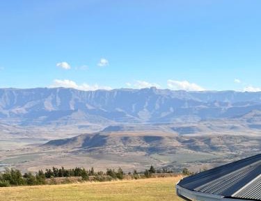 Upstairs Standard Queen with a mountain view