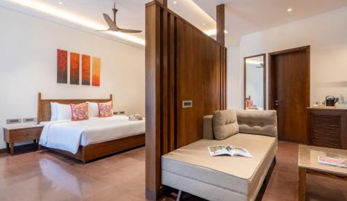 This air-conditioned villa is consisted of of 1 living room, 1 separate bedroom and 1 bathroom with a bath or a shower. The villa's kitchen, which features kitchenware, is available for cooking and storing food. A sofa, a flat-screen TV, a wardrobe and a 