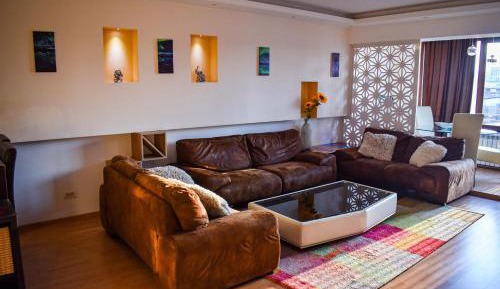 One-Bedroom Apartment with Balcony and City View