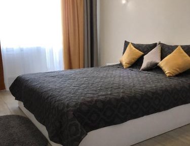 One-Bedroom Apartment with Balcony and City View