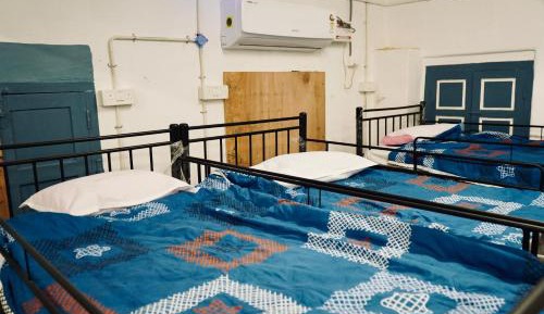 Single Bed in Dormitory Room