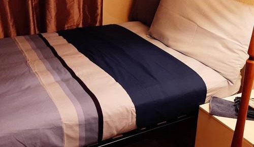 Single Bed in Dormitory Room