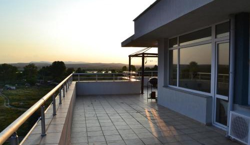 One-Bedroom Penthouse Apartment with Terrace and Pool View