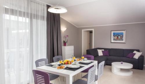 Deluxe Two-Bedroom Apartment with Balcony and City View