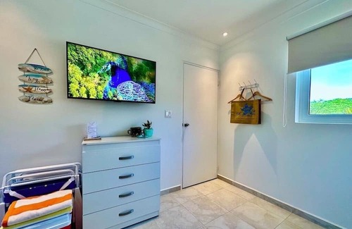 Montana Apartment | Your Tropical Escape with Pool, Spa, and Garden Relaxation