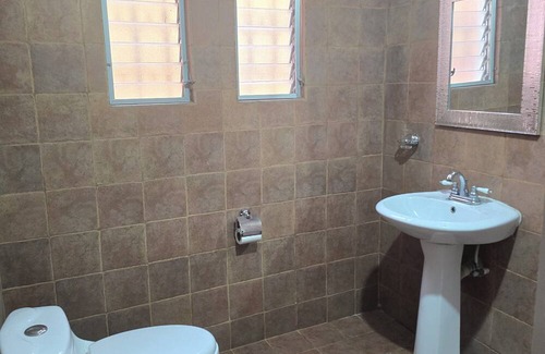 Zona 13 House | Charming bedroom at 3 minutes from the Guatemala city airport.