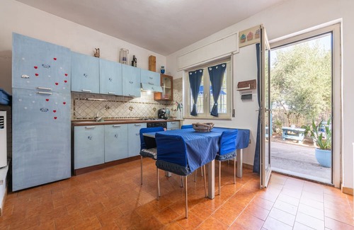 Giba House | Holiday Home 'La Casa Di Coccola' with Private Terrace, Wi-Fi and Air Conditioning