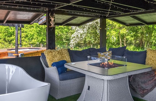 Storwood Cottage | Delightful Outdoor Area with Bath and Fire Pit Awaits You