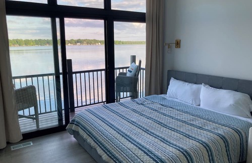 Delton House | Stylish Lake Home with Private Beach & Family Entertainment