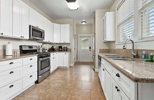 Downtown Riverside House | Pet-Friendly Retreat with Dedicated Workspace & Fenced Yard