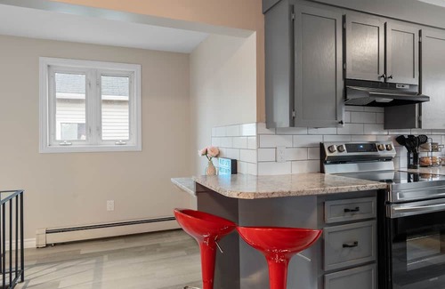 Dieppe House | Modern Retreat with King Bed, Steps from Dining & Starbucks