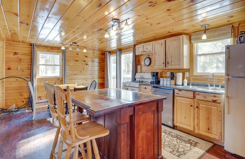 Weirs Beach Cabin | Charming Laconia Cabin near Winnipesaukee Pier & Hot Tub