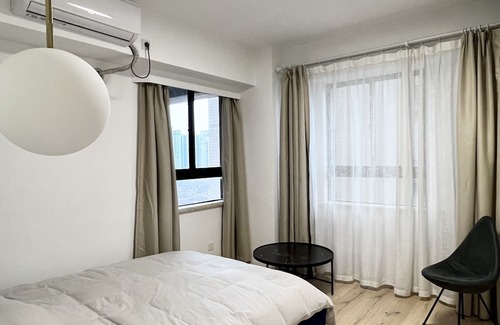 Huaihai Road Commercial Area Apartment | Peaceful Urban Retreat in a Minimalist City Apartment