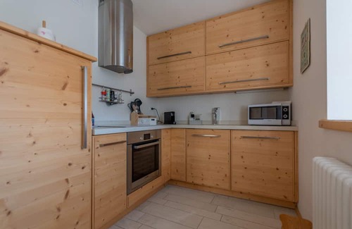 Soraga Apartment | Chalet Francesca: Scenic Lakeside Retreat for Families