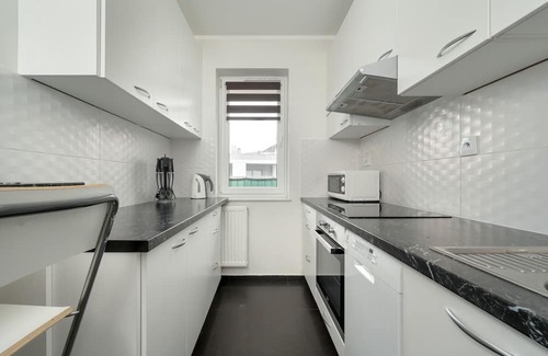 Psie Pole Apartment | Cozy Reymonta 10E Apartment with Balcony & Parking in Wrocław